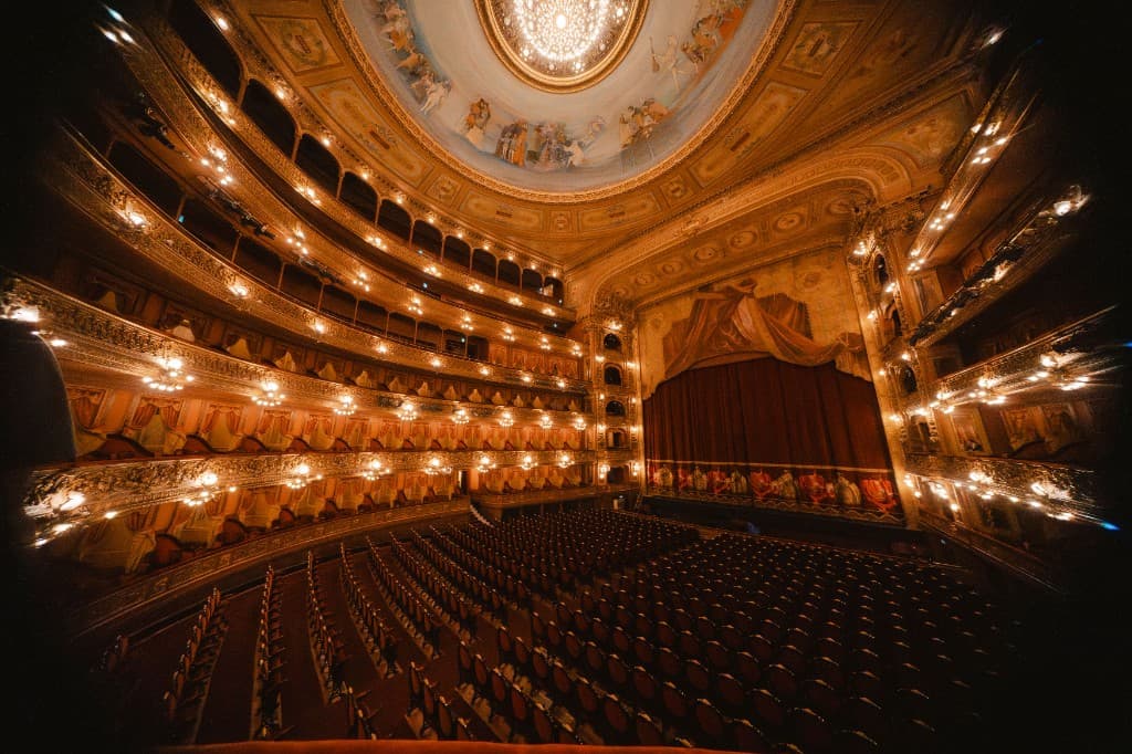 The glowing interior of a grand theatre before the show